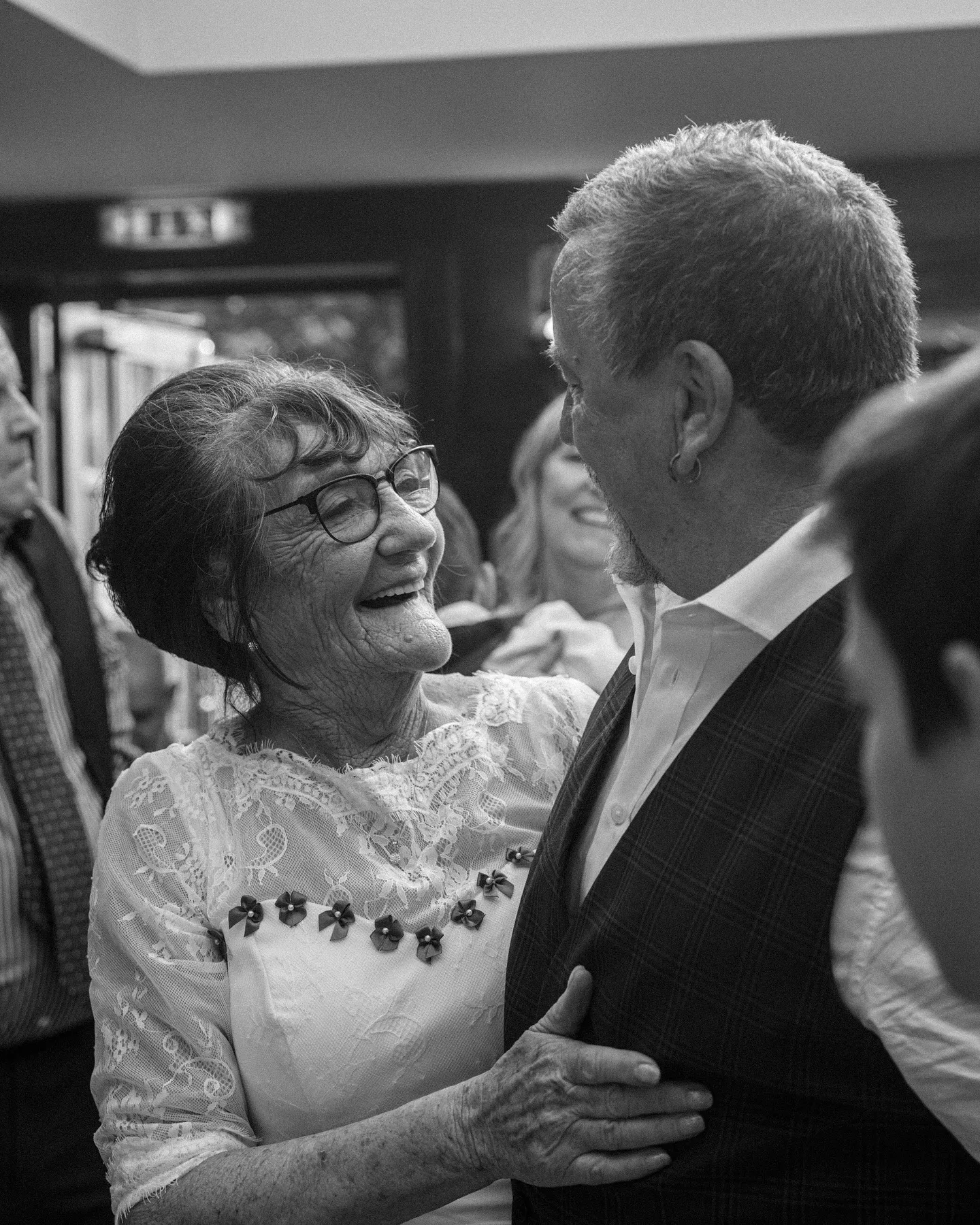 The couple looking at each other and smiling